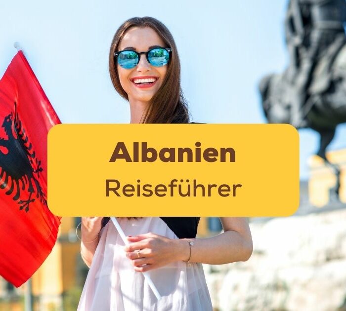 Frau mit albanischer Flagge