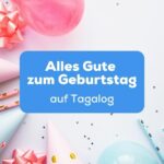 Geburtstaghütchen, Luftballon und Konfetti liegen auf dem Tisch