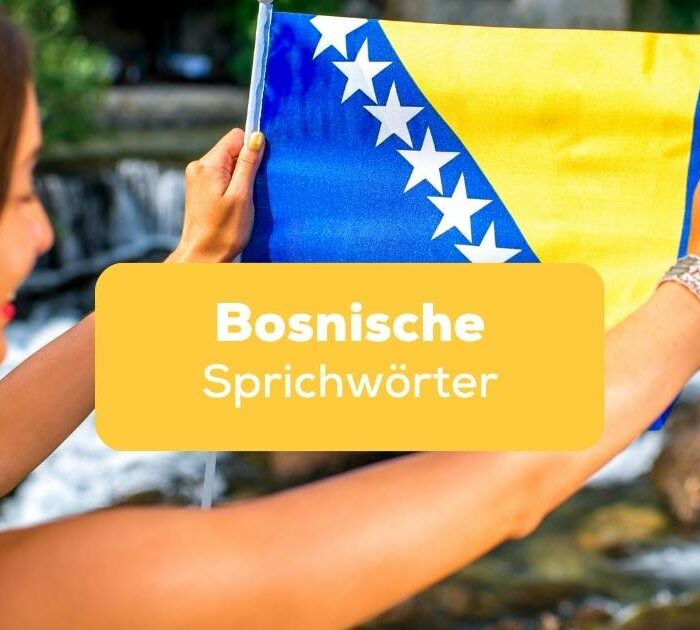 Frau leicht von hinten, und hält die bosnische Flagge in beiden Händen hoch und lernt bosnische Sprichwörter