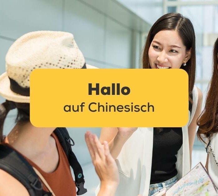 Drei asiatische Freundinnen begrüßen sich mit Hallo auf Chinesisch