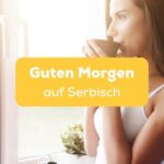 Serbische Frau steht am Fenster mit einem Kaffee am Fenster für einen Guten Morgen auf Serbisch