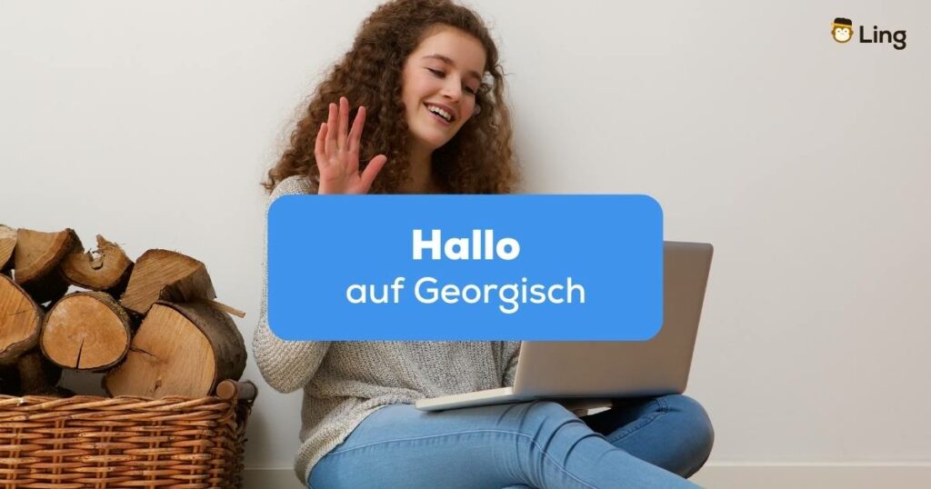 Georgische Frau winkt in den Laptop und sagt Gamarjoba Hallo auf Georgisch
