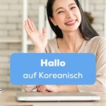 Frau winkt um Hallo auf Koreanisch zu sagen