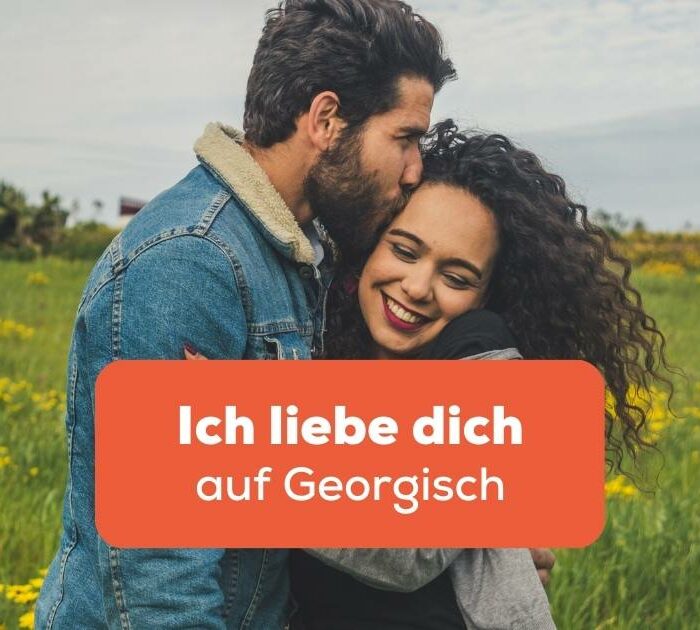 Mann küsst Frau auf die Stirn und sagt Ich liebe dich auf Georgisch