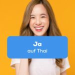 Thai Frau lächelt und freut sich und will ihre Zustimmung mit Ja auf Thai sagen