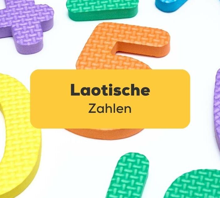 Bunte laotische Zahlen aus Gummi liegen auf einem weißen Hintergrund