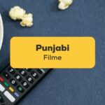 Fernbedienung mit einer Schüssel Popcorn liegt bereit um einen der 7 Punjabi Filme anzuschauen, der bei Ling empfohlen wurde