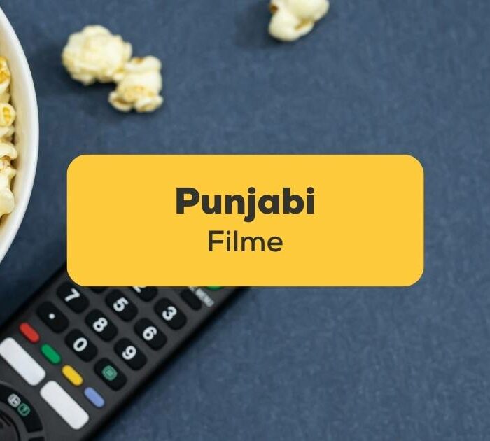 Fernbedienung mit einer Schüssel Popcorn liegt bereit um einen der 7 Punjabi Filme anzuschauen, der bei Ling empfohlen wurde