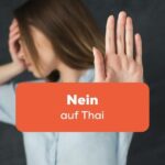 Frau streckt ihre Hand aus um Nein zu sagen