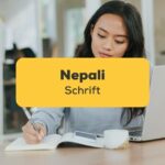 Nepali Schrift Asiatin schreibt in Notizbuch vor Notebook
