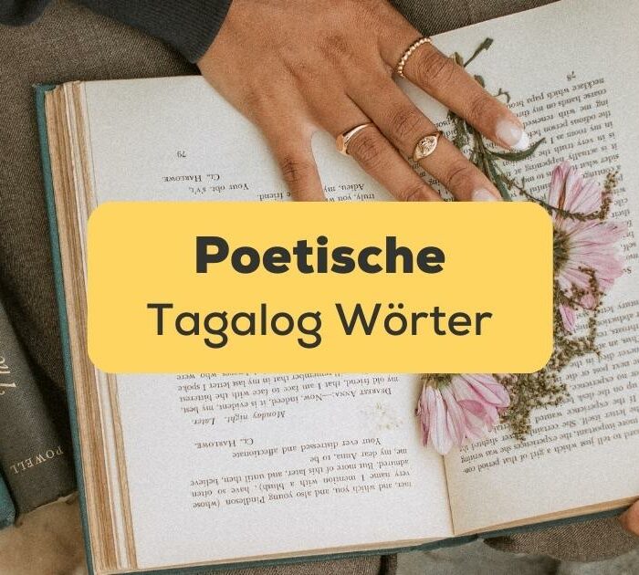 Offenes Buch mit Blumen auf der Seite und Büchern daneben poetische Tagalog Wörter